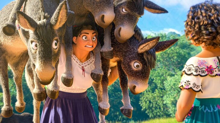 Isabela carrying donkeys with Mirabel