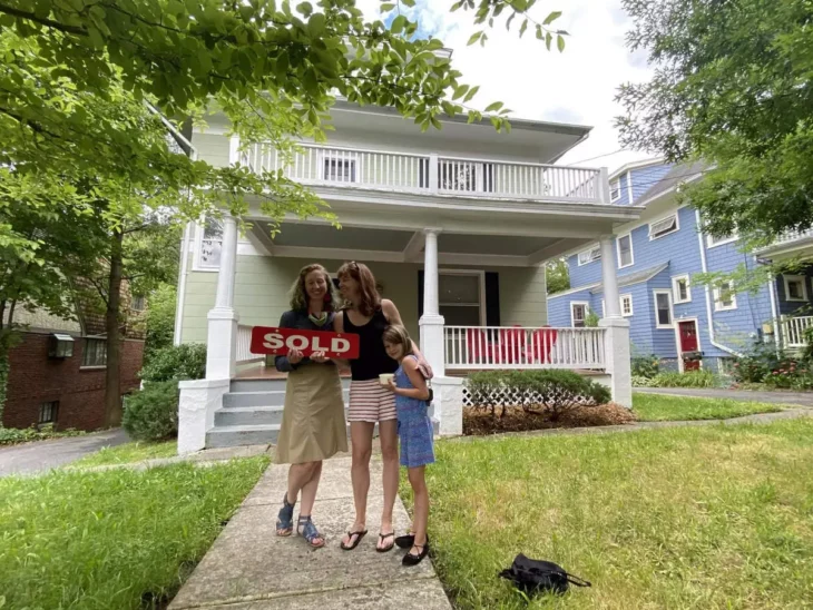 Holly Harper, her daughter and a woman the day she bought her house