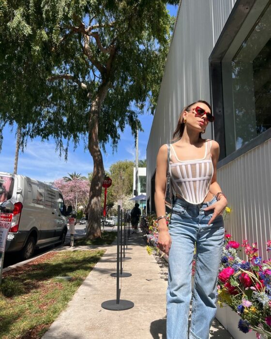 Singer Danna Paola posing in the street of a city 