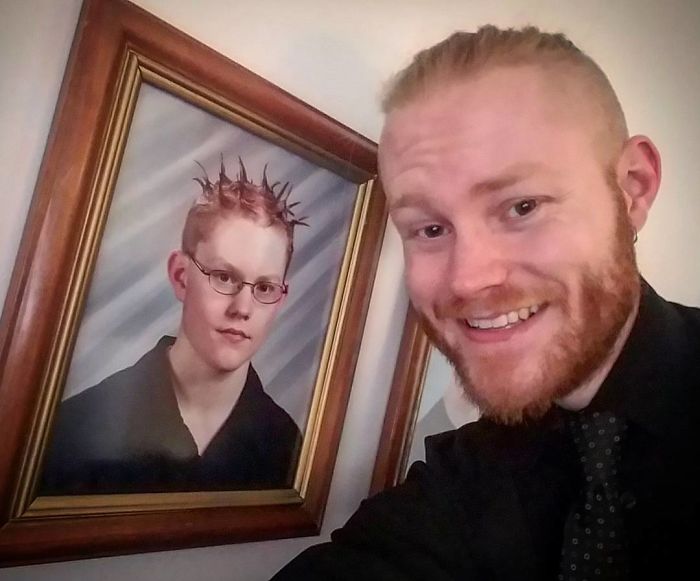 Boy in front of a photo of his adolescence