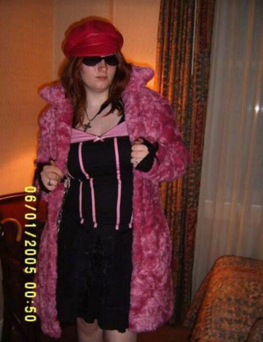 Girl posing with pink teddy coat