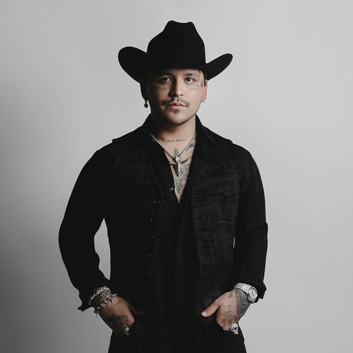 Christian Nodal posing in the photos of Ya No Somos Ni Seremos 