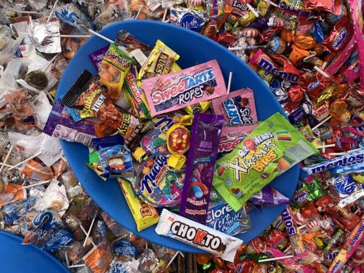 a container with various sweets 