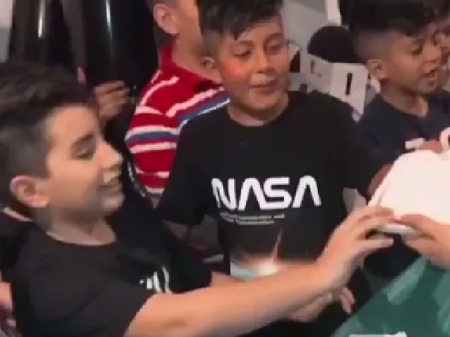 Boy pretends to pass out after biting into his cake 