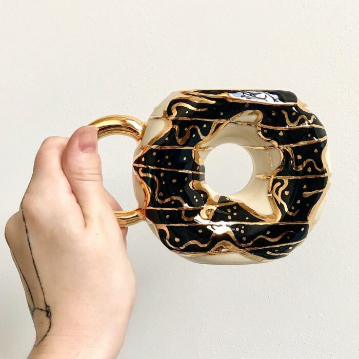 black donut;  Artist Creates Donut-Shaped Cups And They're So Cute You Want To Bite On Them