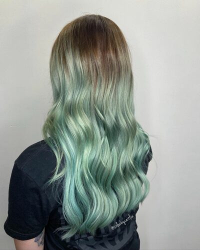 long hair showing off a mint balayage effect