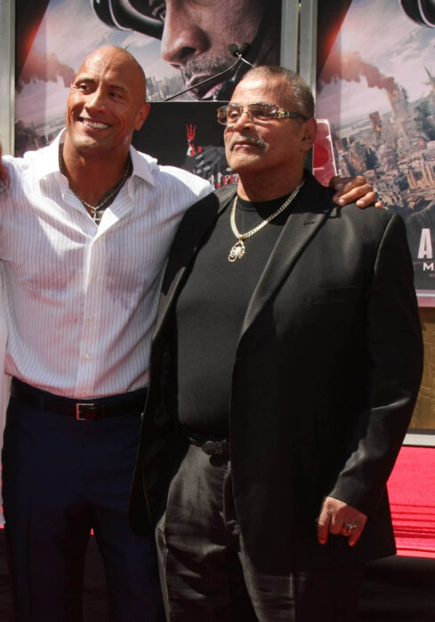 Dwayne Johnson and his father Rocky Johnson at an event, 2015