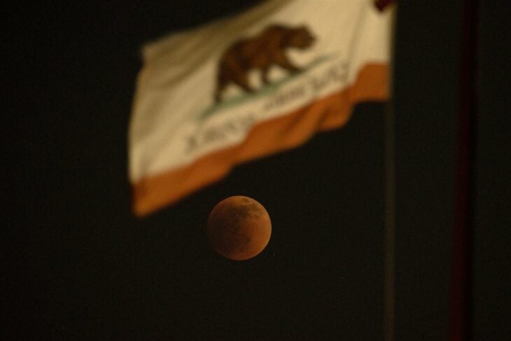 red moon seen from the California flag in El Monte, California in the United States 