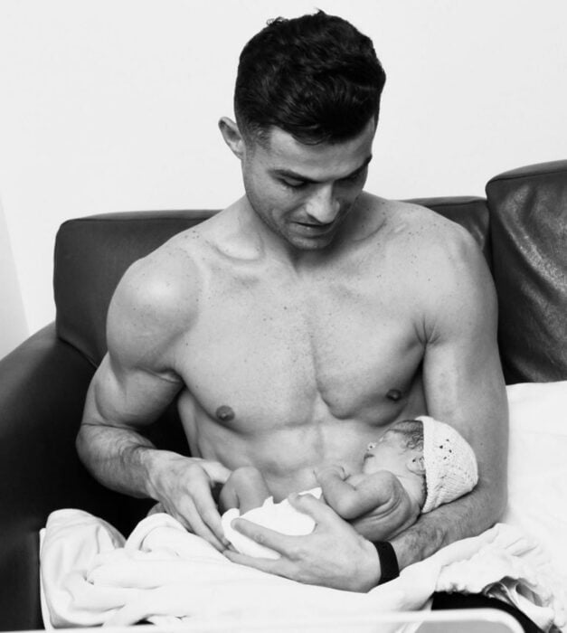 Photograph of Cristiano Ronaldo carrying his newborn Bella Esmeralda