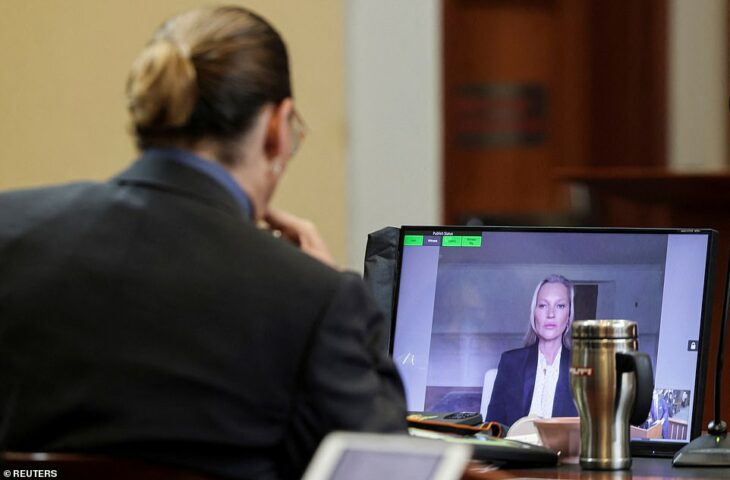 Johnny Depp watching Kate Moss' testimony during her libel trial 