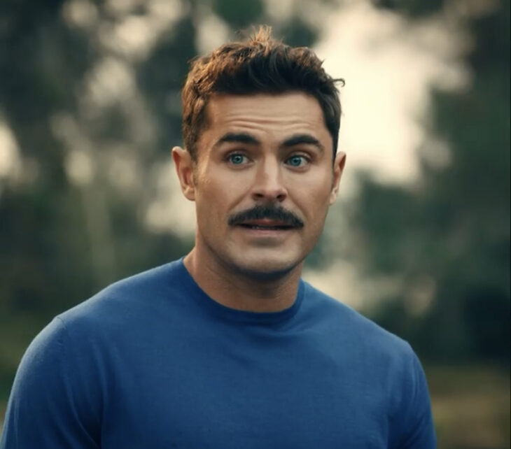 Zac Efron con bigote en una escena de la película Firestarter