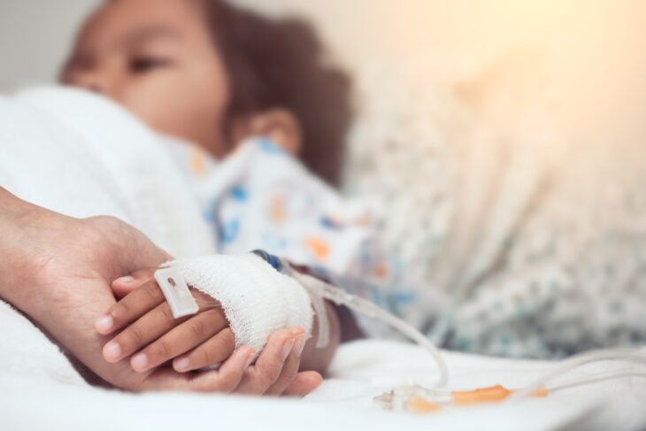 Boy in hospital bed