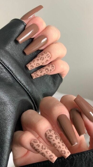 long acrylic nails with animal print design in brown 