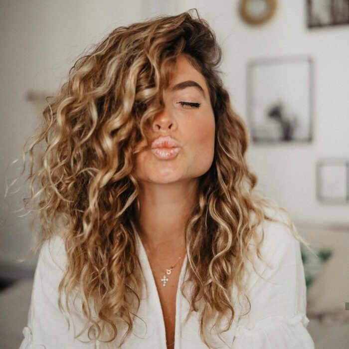 curly gold tone hair