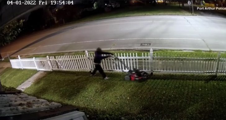 thief mowing the lawn before stealing a mower 