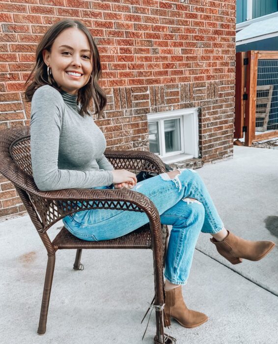 Lexi sitting on a chair