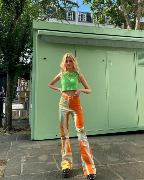 girl posing in the street some tie dye jeans