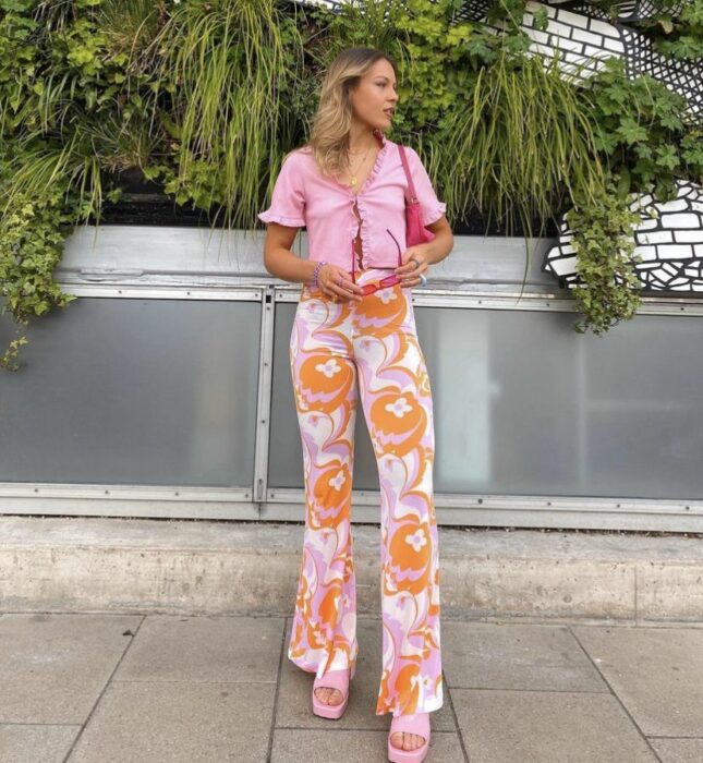 girl posing with flowered jeans 