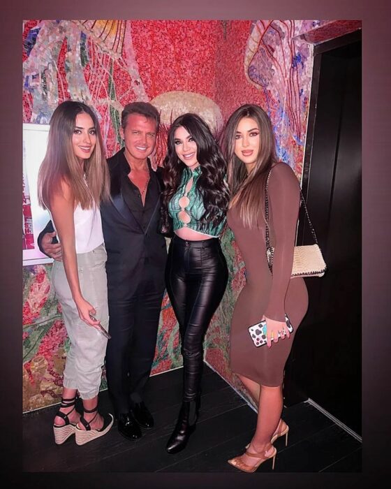 Photograph of Luis Miguel next to three women 