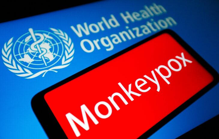 World Health Organization logo with monkey virus sign in red 