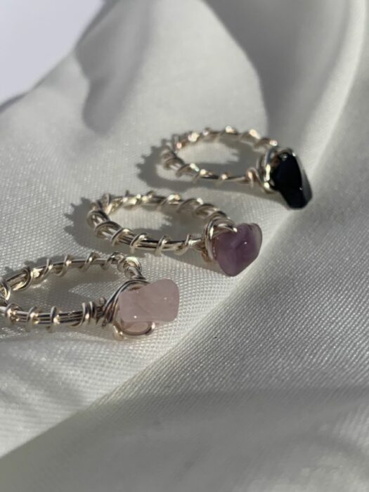 three gray rings with quartz stones in different colors 