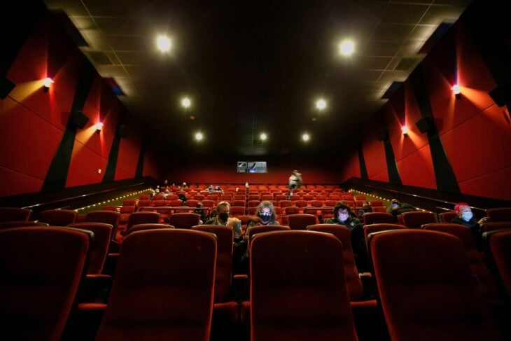 Image showing the movie theater with people watching a tape 