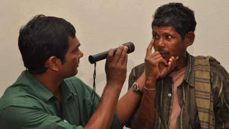 Ophthalmologist performing eye exam