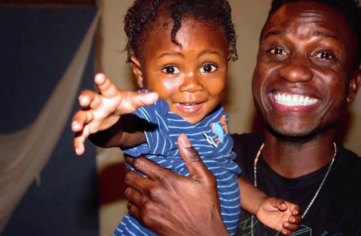 He rescued a baby abandoned in the garbage and adopted him as his son