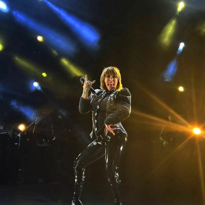 Photograph of Alejandra GuzmÃ¡n on stage at a concert 