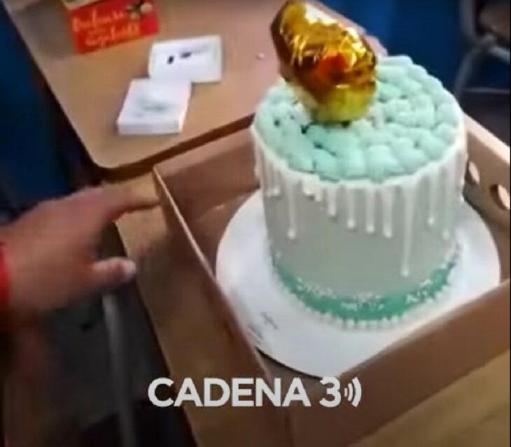 cake with a gold balloon in the middle 