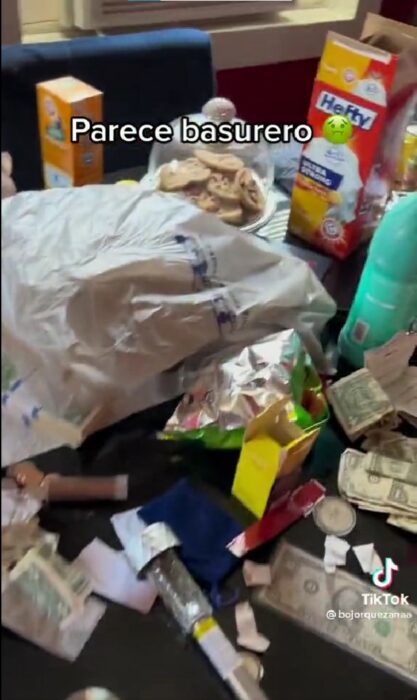 image showing a dining room full of rubbish and thrown away 