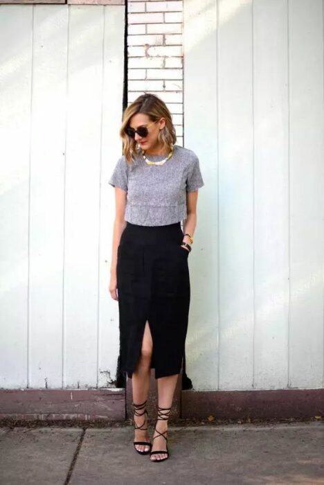 photo of a girl wearing a slit skirt, short-sleeved blouse, and heels 