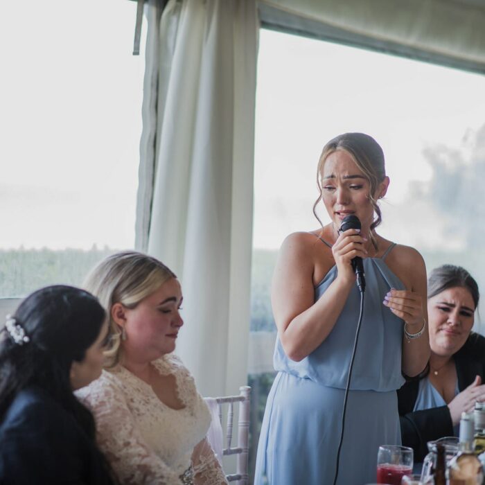 bride listening to a wedding speech