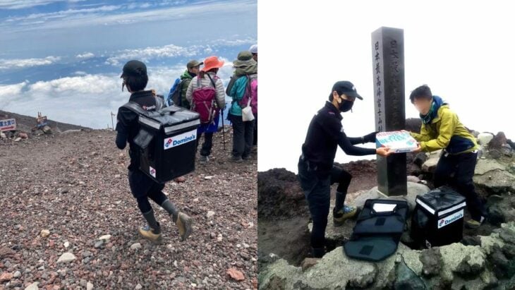 people on top of mount fuji with a food chain delivery man