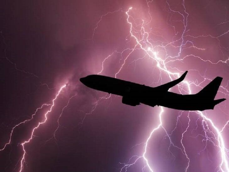 plane flying in the middle of a storm