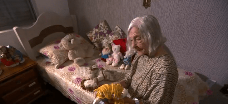 Granny with stuffed animals in bed in her room