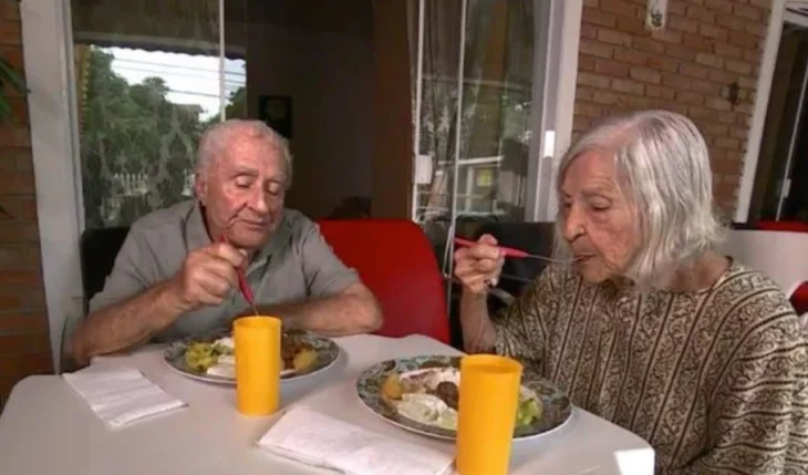 couple of grandparents in love eating