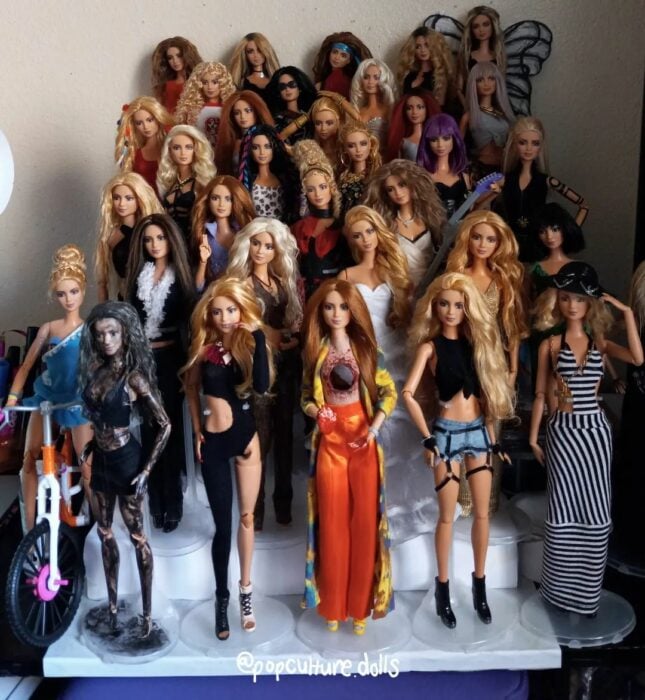 Photograph showing the collection of Barbies inspired by the costumes that Shakira has used in her most famous song videos 