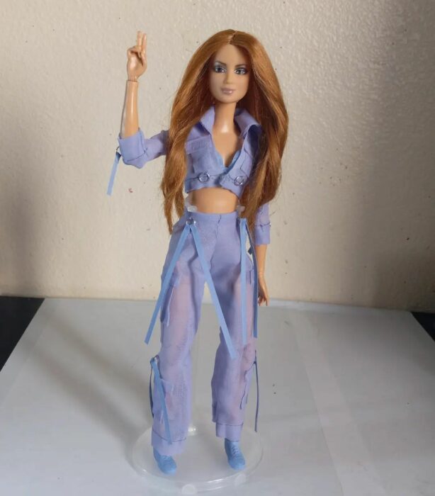 image showing a Barbie doll dressed in Shakira's outfit in the video for her song I congratulate you 
