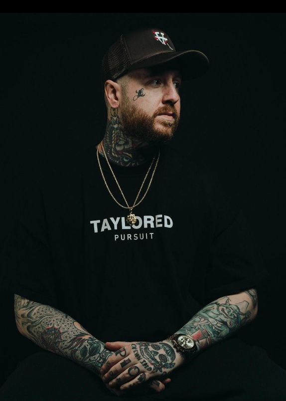 Barber kisses the forehead of his clients after cutting their hair to