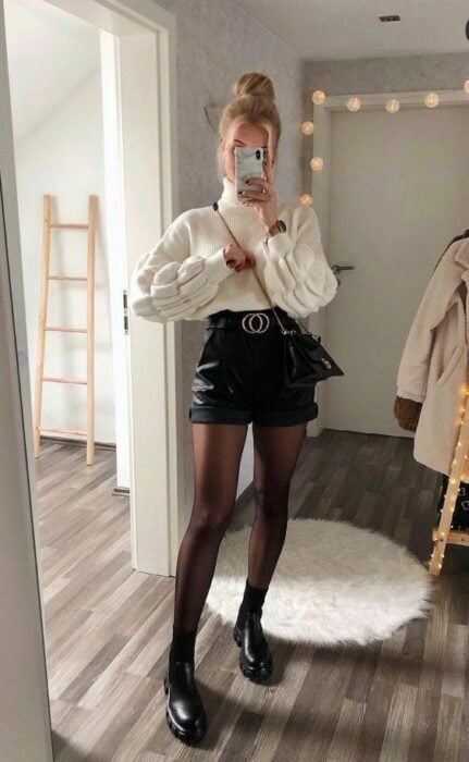outfit with black shorts and white sweater 