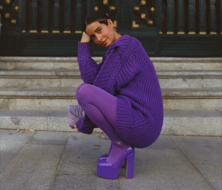 woman in purple clothes purple tights and purple sneakers