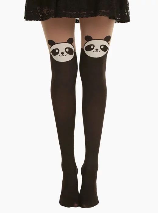 Woman legs in black skirt and black stockings with kawaii panda print