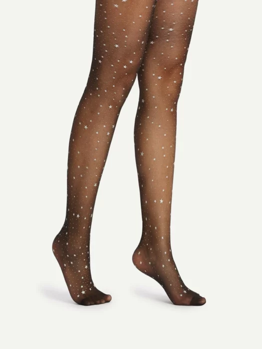 Woman's legs in black skirt and black stockings with white star print