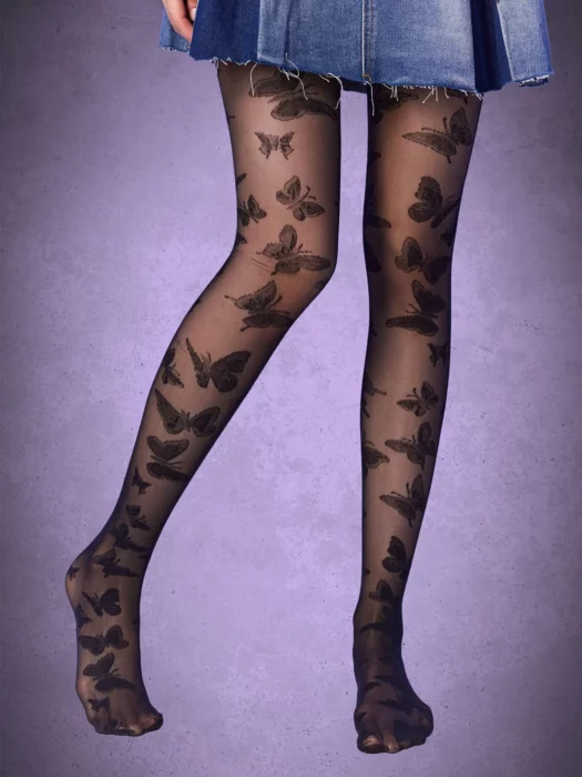 Woman's legs in skirt and black stockings with butterfly print