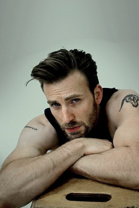 Chris Evans posing in a short-sleeved shirt