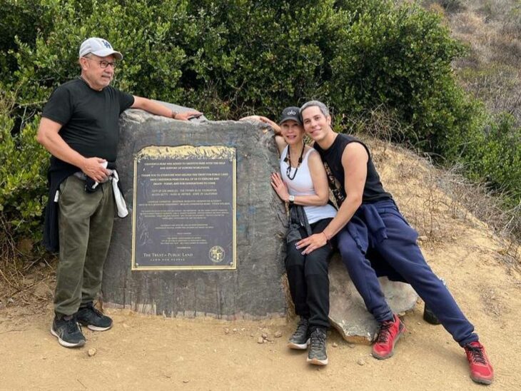 Mexican singer Christian Chávez posing for a photo with his parents 