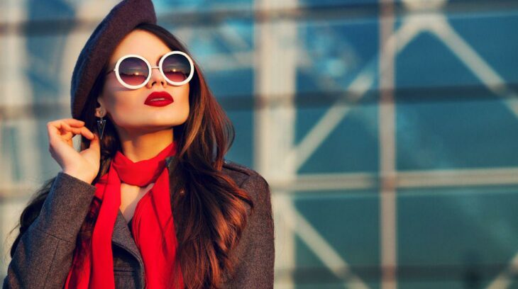 Empowered woman in glasses, beret and red scarf