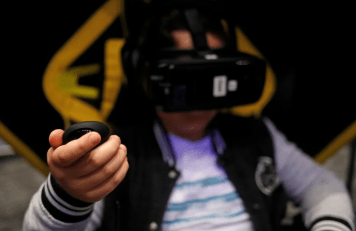 Boy using virtual reality headset 