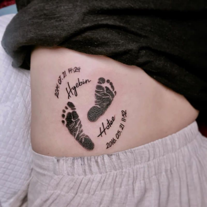 Back with foot print tattoo
